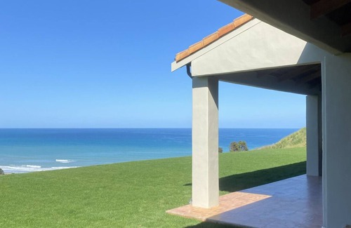 Ocean Beach House | Mediterranean-inspired beach home, surrounded by the Ocean