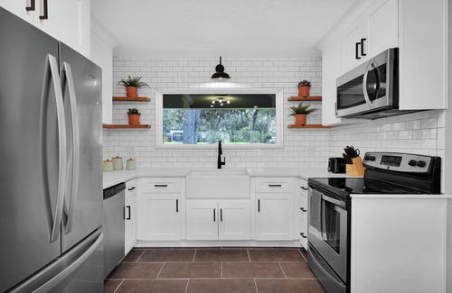 Lakewood House | Mid-Century Boho Chic home with Pool, Game Room & Outdoor Playhouse.