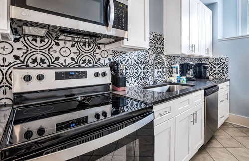 Historic Downtown Savannah Apartment | Mid-Century Cool + Private Parking for 2 Cars on Liberty by Lucky Savannah