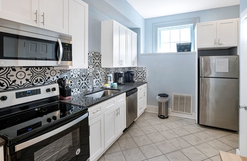 Historic Downtown Savannah Apartment | Mid-Century Cool + Private Parking for 2 Cars on Liberty by Lucky Savannah