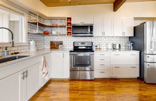 Poulsbo House | Mid-century home with stunning bay & mountain views, wraparound deck