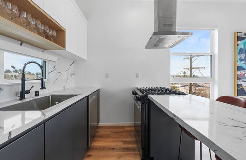 Tri-West Apartment | MidCity 3BR/2BA Townhome with Rooftop, 5 Beds & 2-Car Parking