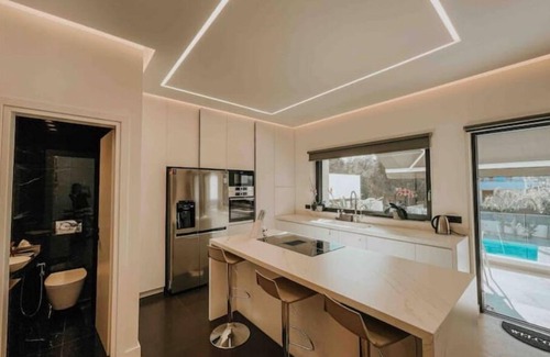 Voula House | Minimal Mezzonette with pool close to beach