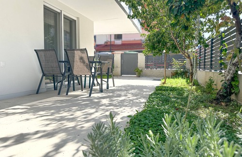 Olymbiaki Akti Apartment | Minimalist Seaside Apartment with Patio and Parking - Blue Zone Homes