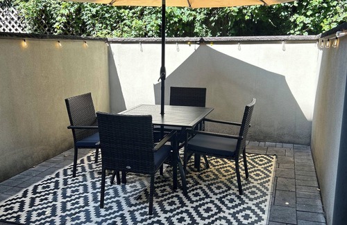 Upper Manhattan Apartment | Modern 1-bedroom Garden Apartment with Backyard, up to 25 mins to Times Square