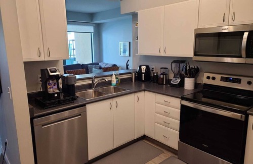 Downtown West End Condo | Modern 1BR DT Condo by Bow River & C-train w/Patio, Gym & underground parking