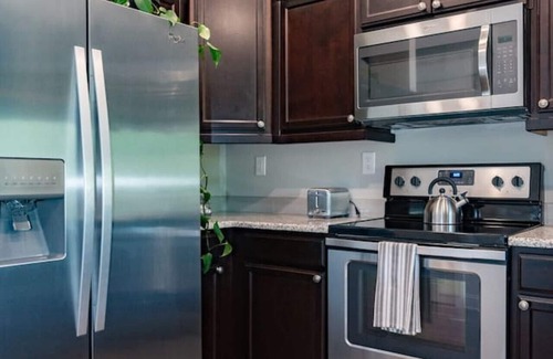 Central Business District Apartment | Modern 1BR Flat: Free Parking, AC, Getaway Ready!