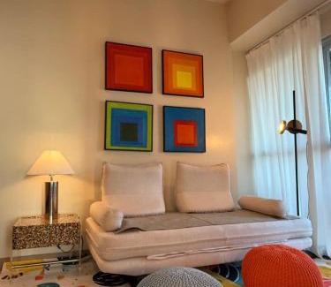 Tambo Apartment | Modern 1BR with Balcony Facing Infinity Pool Manila Bay Sunset Near Airports OKADA Solaire MOA