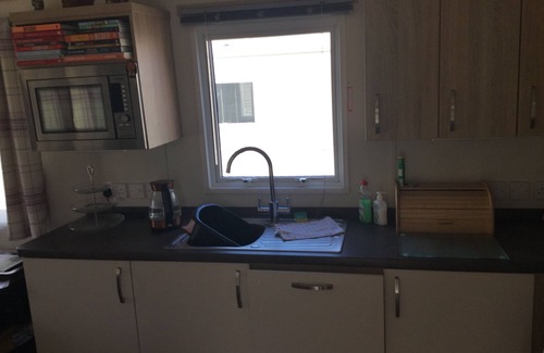Dawlish Warren House | Modern 2 bed caravan with surrounding decking and patio; sleeps up to 6 people