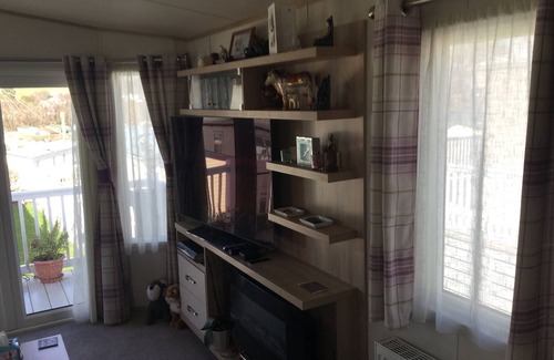 Dawlish Warren House | Modern 2 bed caravan with surrounding decking and patio; sleeps up to 6 people