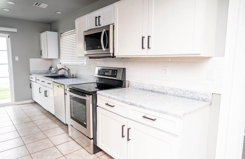 Northeast Carrollton House | Modern 2-bedroom home with loft and indoor fireplace!