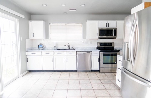 Northeast Carrollton House | Modern 2-bedroom home with loft and indoor fireplace!