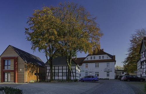 Bad Essen House | Modern 2-storey apartment in a listed half-timbered house on the market