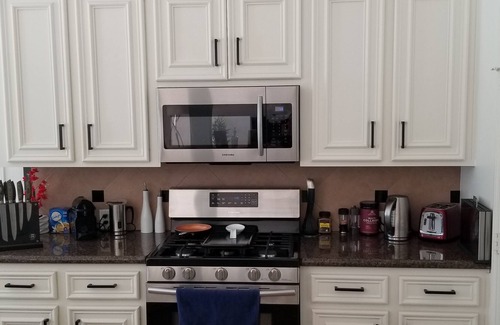 Pearland House | Modern 2br house with glass fireplace and patio.