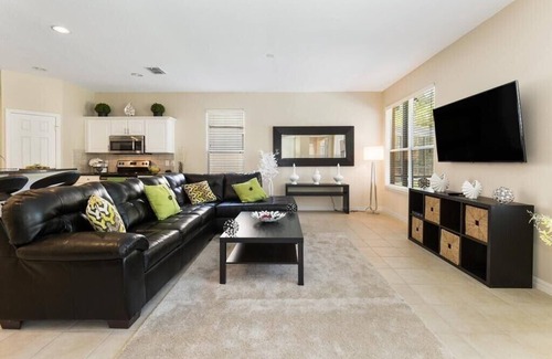 Watersong Villa | Modern 4-Bedroom Villa with Pool, Spa, Game Room & BBQ – 20 Min to Disney