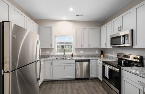 Grandville Apartment | Modern 4BR 4BA Two Unit Condo w Garage and Patio