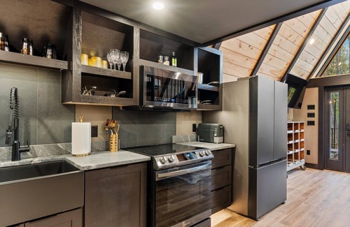 Sebago House | Modern A-frame house with hot tub and fire pit. Very private!