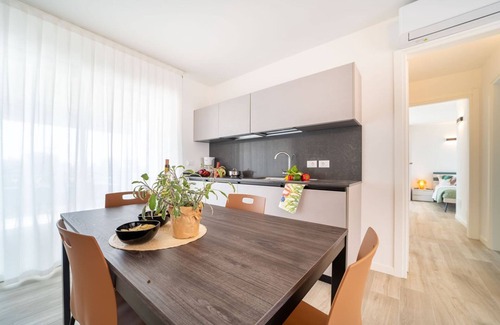 Lignano Sabbiadoro Apartment | Modern apartment with solarium and panoramic lagoon and seaview