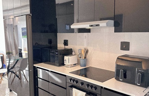 Flamingo Vlei Apartment | Modern Apartment in Blouberg. Table Mountain and Sea views | AVINA @ Blouberg
