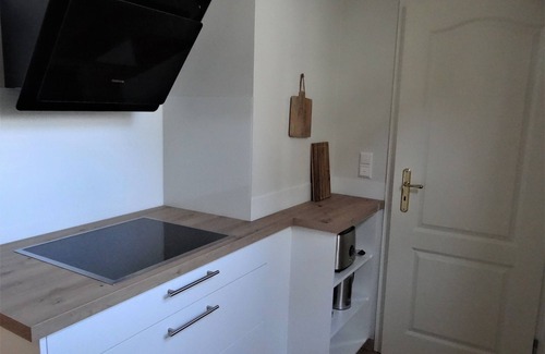 Bad Essen Apartment | Modern apartment with a fireplace in a listed half-timbered house on the market square