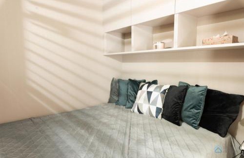 Dziaki Lesne Apartment | Modern Beige and Grey 3city Apartment in Gdynia by Noclegi Renters