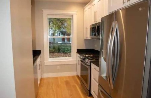 Riverside Apartment | Modern Cambridge oasis with EV parking and yard