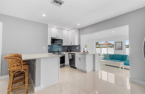 North Palm Beach House | Modern Coastal Home with brand NEW HEATED private saltwater pool!