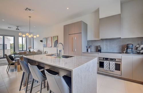 Westwind Condo | Modern condo, steps to beach. Gym, generator, gated community.