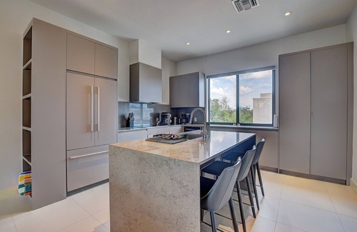Westwind Condo | Modern condo, steps to beach. Gym, generator, gated community.