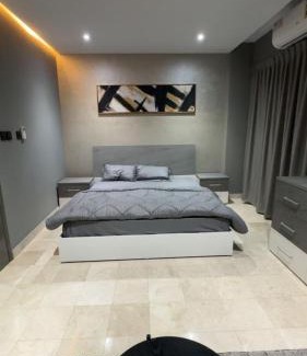 Al Koudh Apartment | Modern Cozy Apartment with Elegant Gray Design & Smart Lighting