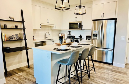 Springbank Hill Condo | Modern cozy brand new condo close to all amenities and the mountains.