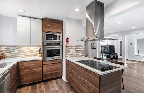 Bushkill House | Modern Creek-front House with Volleyball court in the backyard.