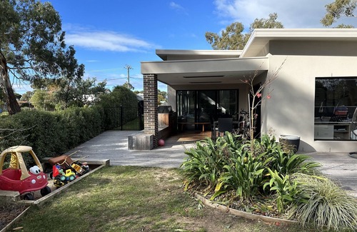 Seven Mile Beach House | Modern Family House in Seaside Village - Close to Airport, Beach and Golf Course
