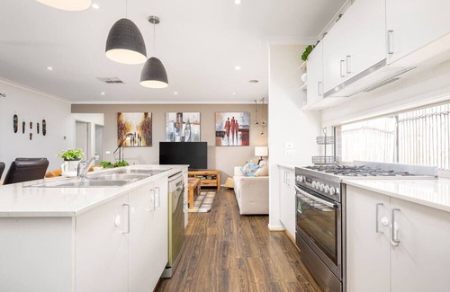 Clyde North House | Modern Family Friendly Retreat Home with Sunroom