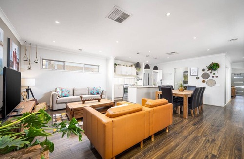 Clyde North House | Modern Family Friendly Retreat Home with Sunroom