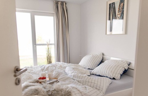 Olpenitz Condo | Modern ground floor apartment with direct water view, terrace and WiFi