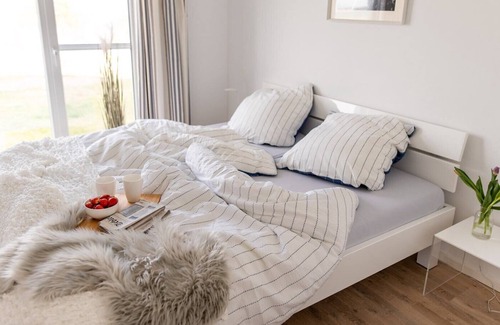 Olpenitz Condo | Modern ground floor apartment with direct water view, terrace and WiFi