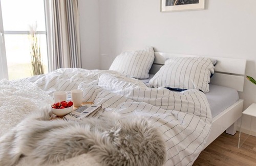 Olpenitz Condo | Modern ground floor apartment with direct water view, terrace and WiFi