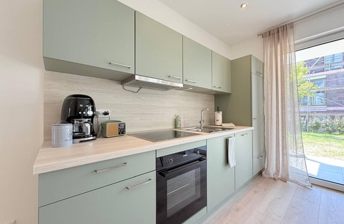 Unteruhldingen Apartment | Modern Harmony suite with covered terrace near the lake and beach in Uhldingen-