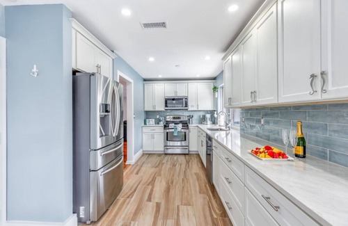 Imperial Point House | Modern Heated Pool Sand Ocean access Firepit BBQ