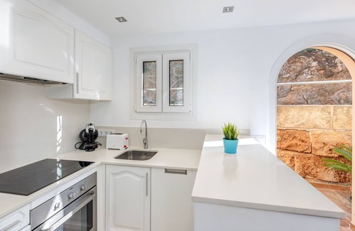 Cala Carbo Apartment | Modern Holiday Apartment with Sea View, Pool, Balconies, Air Conditioning and Wi-Fi
