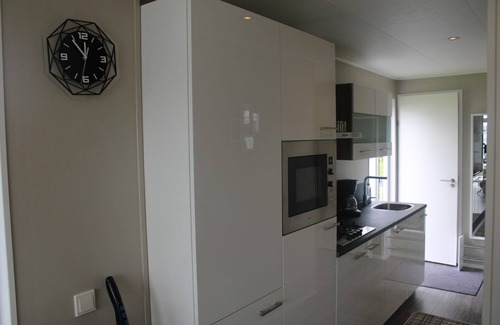 Lathum House | Modern holiday home with a view of a tranquil pond