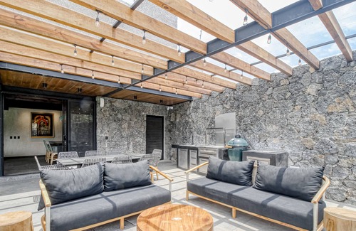 Tepoztlan House | Modern home with a private pool, hot tub, outdoor kitchen, & mountain views