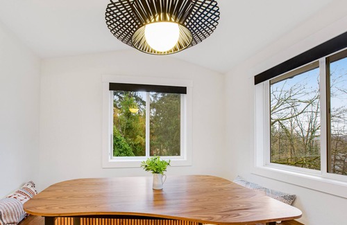 Milton House | Modern home with outdoor fireplace, rock-wall, & walk-in shower
