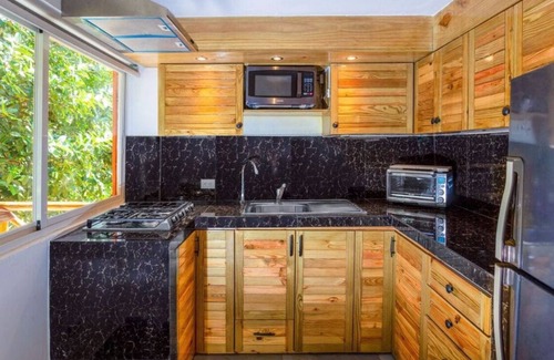 Puerto Bahia Apartment | Modern jungle studio with jacuzzi near quiet beach