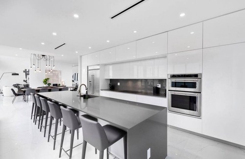 Glenvar Heights Villa | Modern Lakefront Villa w/Pool, Jacuzzi and Gym