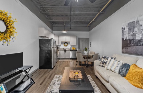 Baytown Apartment | Modern Loft Vibes Exposed Brick + Cozy Design