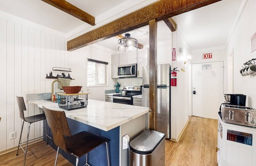 Fish Camp House | Modern lower unit duplex cabin with fireplace, balcony, & EV charger