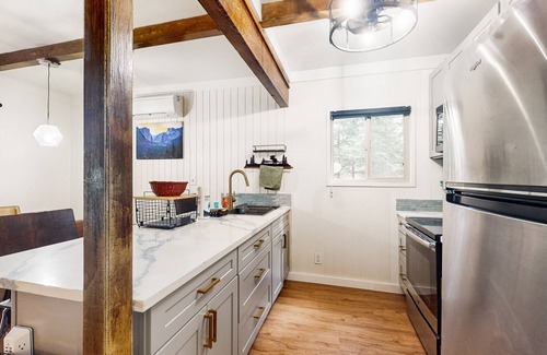 Fish Camp House | Modern lower unit duplex cabin with fireplace, balcony, & EV charger