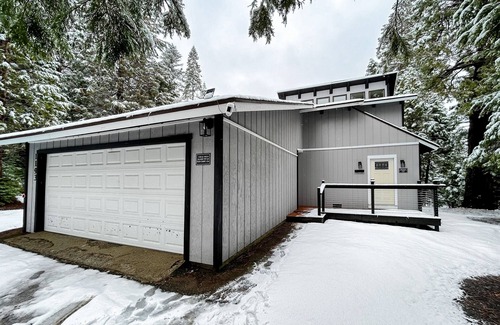 Fish Camp House | Modern lower unit duplex cabin with fireplace, balcony, & EV charger